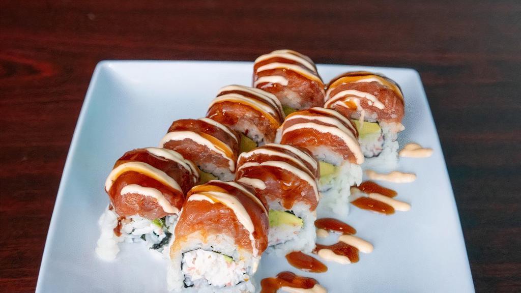 Rose Roll · Raw. Crab and avo. Topped with spicy tuna. 
Unagi sauce and spicy mayo