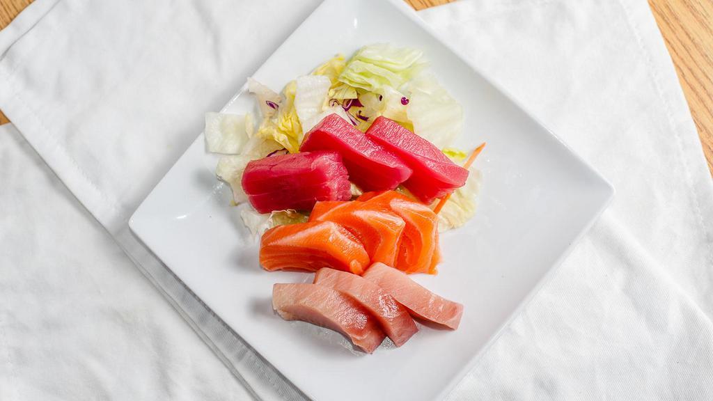 Shashimi Plate (9 Pcs) · Raw. Tuna, salmon, hamachi, and salad.