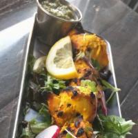 Tandoori Chicken Tikka on a skewer · Skewed Tandoori  chicken breast cubes  served  on grilled bell peppers and onion  and basmat...