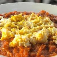 Mirza Ghasemi · A combination of tomatoes, garlic, mashed grilled eggplants, and eggs.