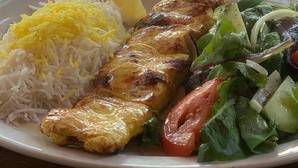 Jujeh Kabob · Marinated charbroiled boneless chicken breast, served with basmati rice topped with saffron.