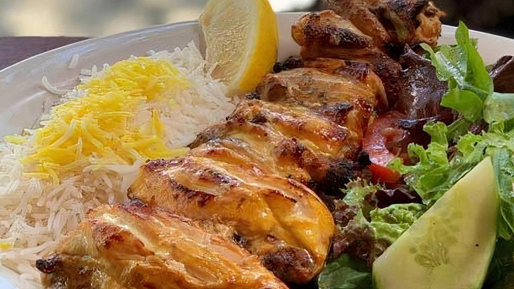 Jujeh with Bone Kabob · Delicious marinated charbroiled cornish hen topped with saffron.