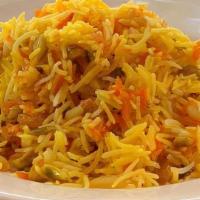 Shirin Polo · Plain cooked rice topped with a mixture of slivered almonds, pistachio nuts, orange marmalad...
