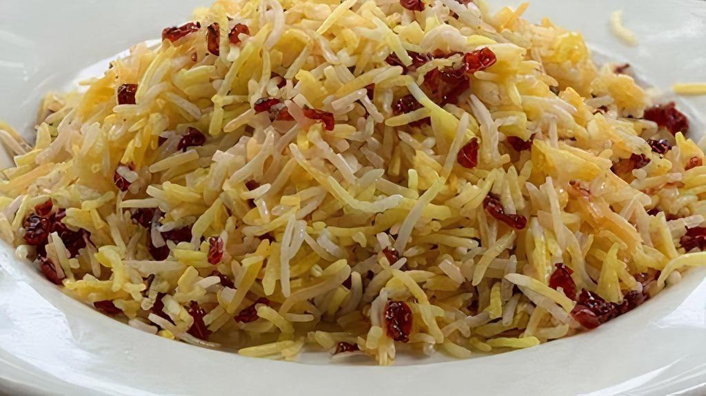 Zereshk Polo · Basmati rice with barberries and saffron.