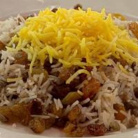 Adas Polo · Basmati rice with lentils golden raisins, and saffron.