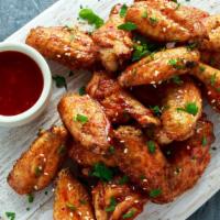 Fried Sweet Chilli Wings · Sweet chilli sauce smothered on fried chicken wings.