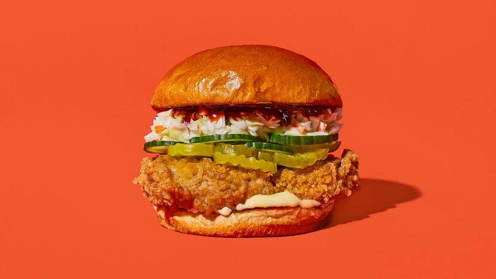 Yangnyeom · Our signature fried chicken served on a toasted bun and topped with coleslaw, pickles, cucumbers, mayonnaise and spicy gochujang sauce.