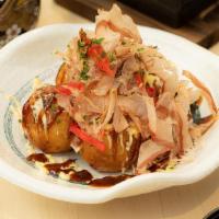 5pc Takoyaki  章魚燒 · Five pieces. Japanese octopus in ball dough, mayonnaise, bonito, and nori flake.