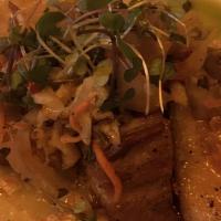 Chicharon · Served with crispy pork belly, fried yucca, cabbage curtido, cilantro.