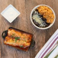 Enchilada · Corn tortillas, chicken tinga, guajillo and New Mexico chili sauce, cheese, side .