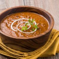 Mughalai Dal Makhnni · Slowly pot cooked organic whole black lentils & kidney beans
