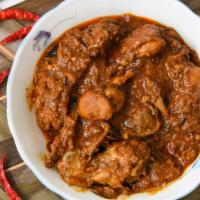 Lamb Curry · Lamb cooked with organic onion & tomato with Indian herbs & spices.