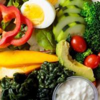 1. Julie's Organic Green Salad · Spring mix, avocado, kale, bell pepper, mango, cherry tomato, broccoli, and egg with balsami...