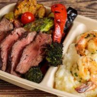 10. Steak & Shrimp Plate · Fresh black angus hanger steak over seasonal grilled vegetables with garlic butter shrimp ov...