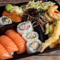 11. Sushi Bento Plate · Nigiri sushi, California rolls, tuna maki, Inari sushi, avocado shrimp, papaya salad, soba n...