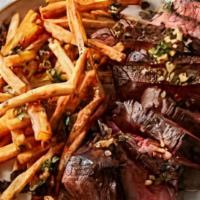 Steak Frites · Cast-iron seared niman ranch rib eye with bearnaise butter and scallion pommes frites.