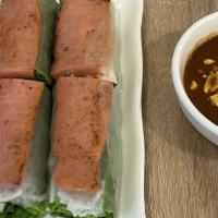 Nem Nướng Cuốn Chả Ram · Grilled pork spring roll served with hoisin peanut sauce (two pieces).