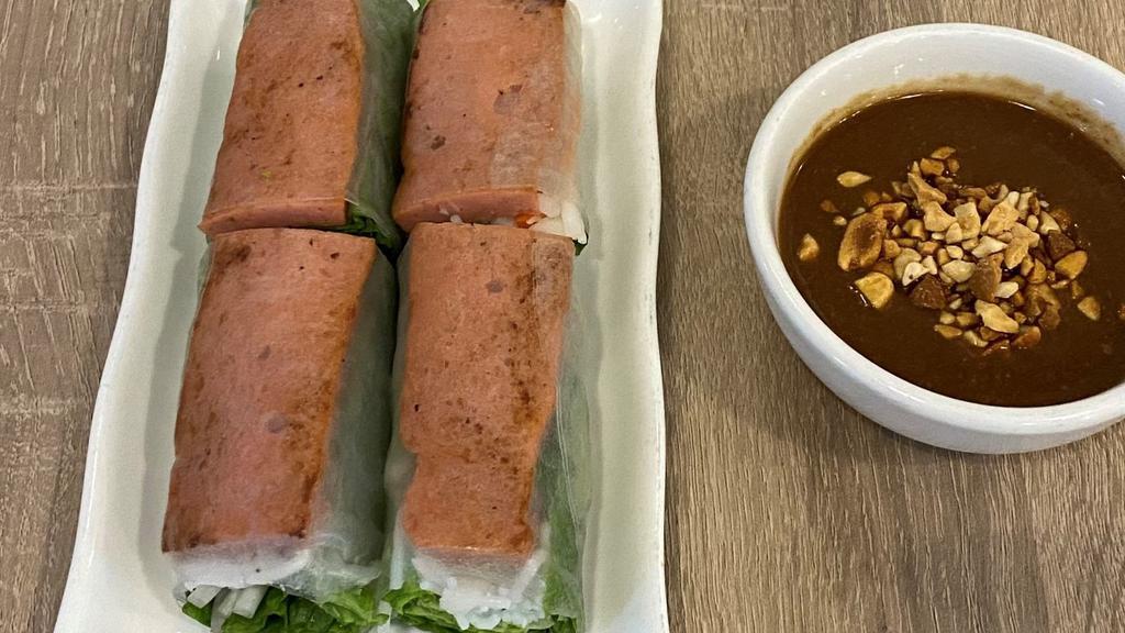 Nem Nướng Cuốn Chả Ram · Grilled pork spring roll served with hoisin peanut sauce (two pieces).