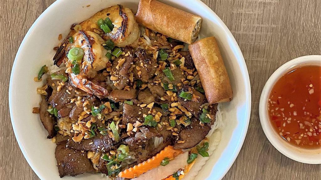 Bún Tôm Thịt Nướng Chả Giò · Grilled pork, shrimp and egg roll over vermicelli and vegetables.