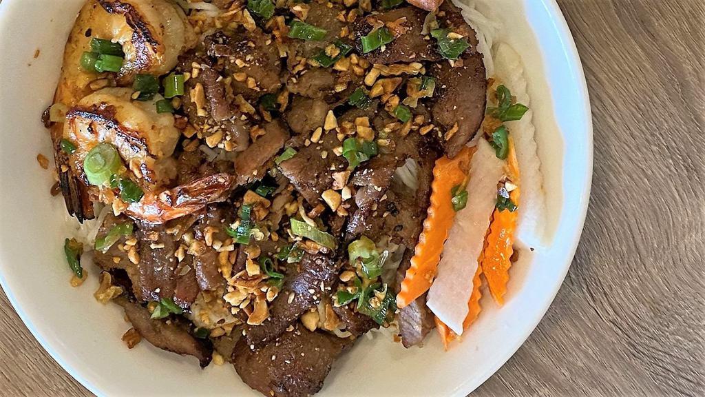 Bún Tôm Thịt Nướng · Grilled shrimp and pork over vermicelli and vegetables.