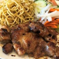 Gà Rô Ti Mì Tỏi · Grilled boneless chicken thighs served with garlic noodle and vegetables.