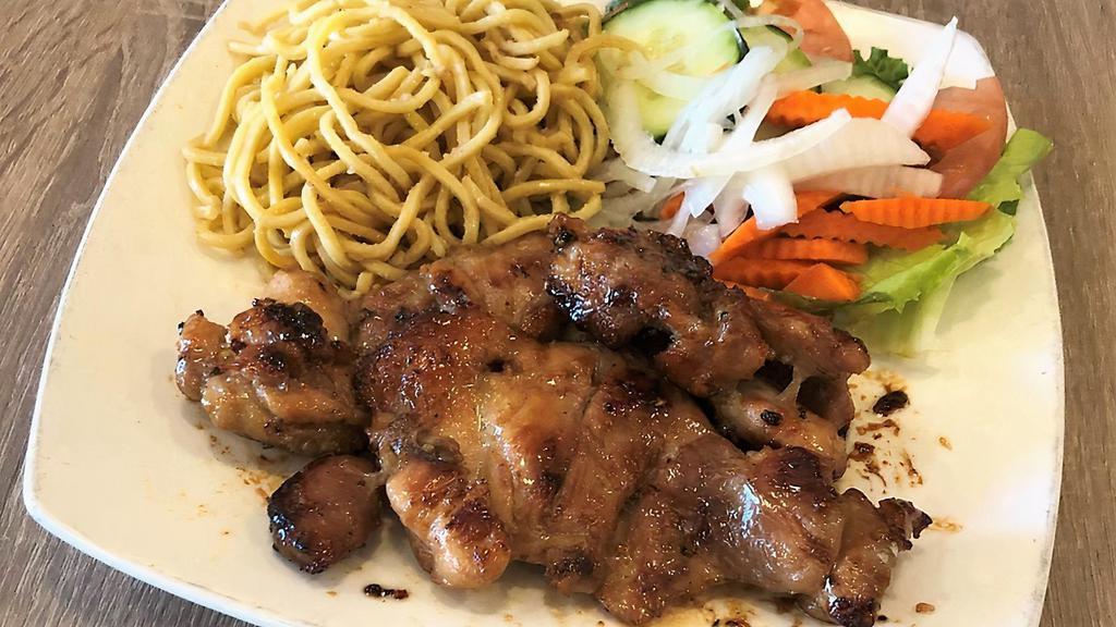 Gà Rô Ti Mì Tỏi · Grilled boneless chicken thighs served with garlic noodle and vegetables.