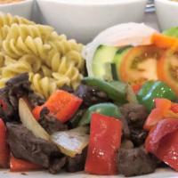 Nui Xào Bò Luc Lắc · Stir-fried filet mignon beef cubes with garlic pasta and vegetables.