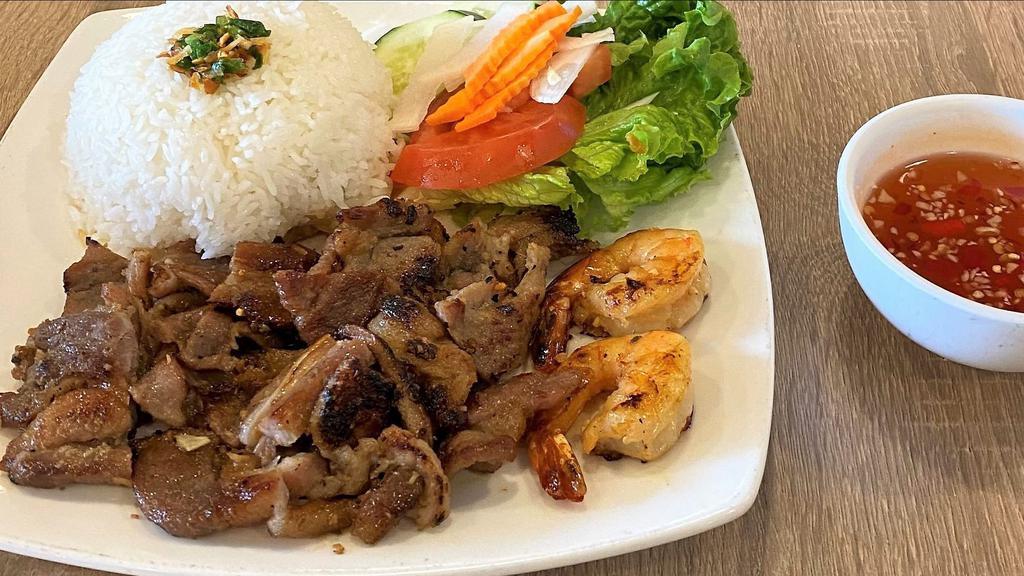 Cơm Tôm  Thịt Nướng · Grilled sliced pork and shrimp with steamed rice and vegetables.