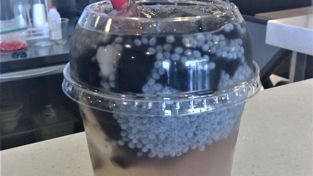 Sương Sáo Thập Cẩm · A combination of grass jelly in young coconut juice.