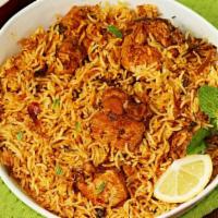 Chicken Biryani · Chicken sauteed with mild spices & herbs, cooked with basmati rice, garnished with fried oni...