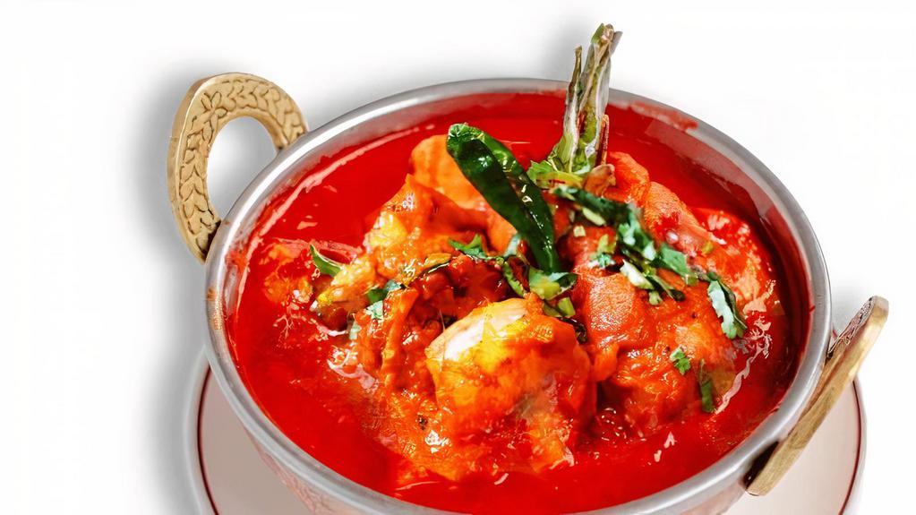Prawn Vindaloo · Prawns cooked with spicy sauce and potatoes.