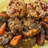 Tender Braised Oxtail · Served w/ Rice and Beans & Fried Plantains