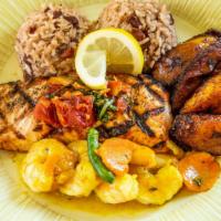 Curried Shrimp & Jerk Salmon · Served w/ Rice and Beans & Fried Plantains