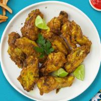 Class of Cajun Wings · Fresh chicken wings breaded, fried until golden brown, and tossed in cajun dry rub.Served wi...