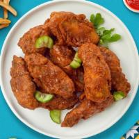 Fire Extreme Wings · Fresh chicken wings breaded, fried until golden brown, and tossed in original hot sauce. Ser...