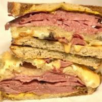 Grilled NY Famous Reuben · With sauerkraut and 1000 island dressing, with your choice of pastrami, corned beef, turkey ...