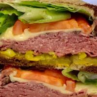 Grilled Genuine NY Corned Beef · With swiss cheese.