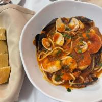 Spaghetti Cioppinno · mussels, clams, prawns, calamari with spicy marinara sauce.