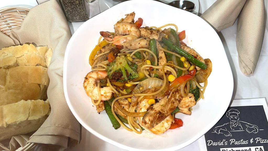 Spaghetti Marco Polo · Prawns, chicken, bell peppers, onions, corn with garlic soy sauce