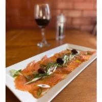 Smoked Salmon · Palermo style, smoked norwegian salmon prepared with olive oil, lemon, pepper, and thinly sl...