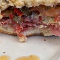 Godfather Sandwich · Toscano salami, antipasta, Asiago cheese, tomato and spicy mustard on a sourdough roll.
