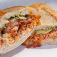 #21. Chicken Lickin' · Roasted Chicken, Sun-dried tomato sauce, bacon, avocado, melted Monterrey Jack