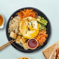 Veggie Dol Sot Bibimbab · Assorted vegetable with fried egg over rice in sizzling hot stone ware.