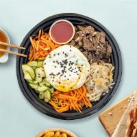 Babbling Bibimbab · Meat and assorted vegetable with fried egg over rice choice of beef, pork or chicken.
