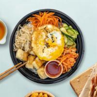 Veggie Paradise Bibimbap · Tofu and assorted vegetable with fried egg over rice.
