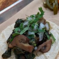 SAUTEED MUSHROOM & SPINACH TACO · Sauteed mushroom and spinach, rajas, salsa verde, onion, cilantro. *Mushrooms, spinach and r...