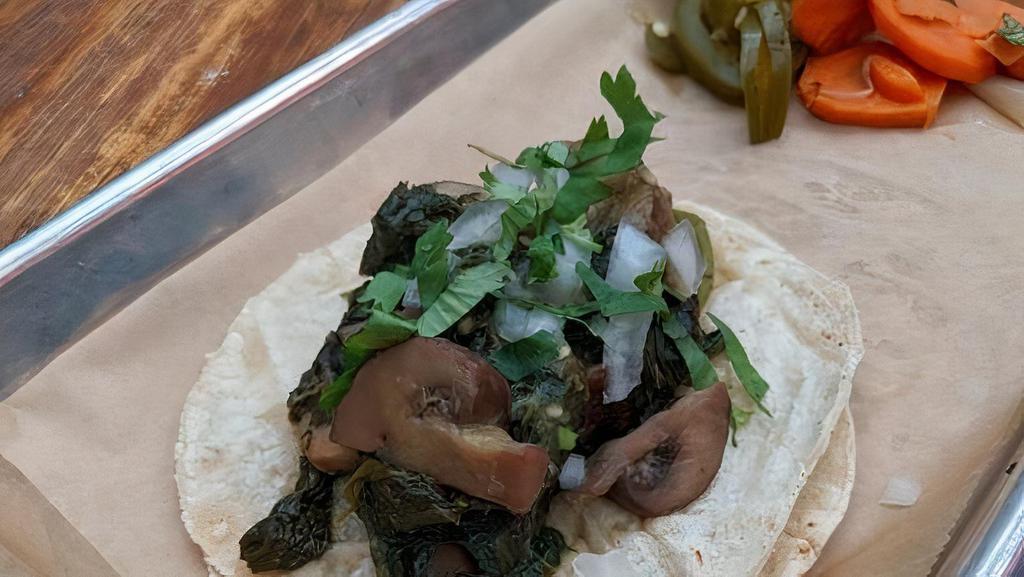 SAUTEED MUSHROOM & SPINACH TACO · Sauteed mushroom and spinach, rajas, salsa verde, onion, cilantro. *Mushrooms, spinach and rajas cannot be separated