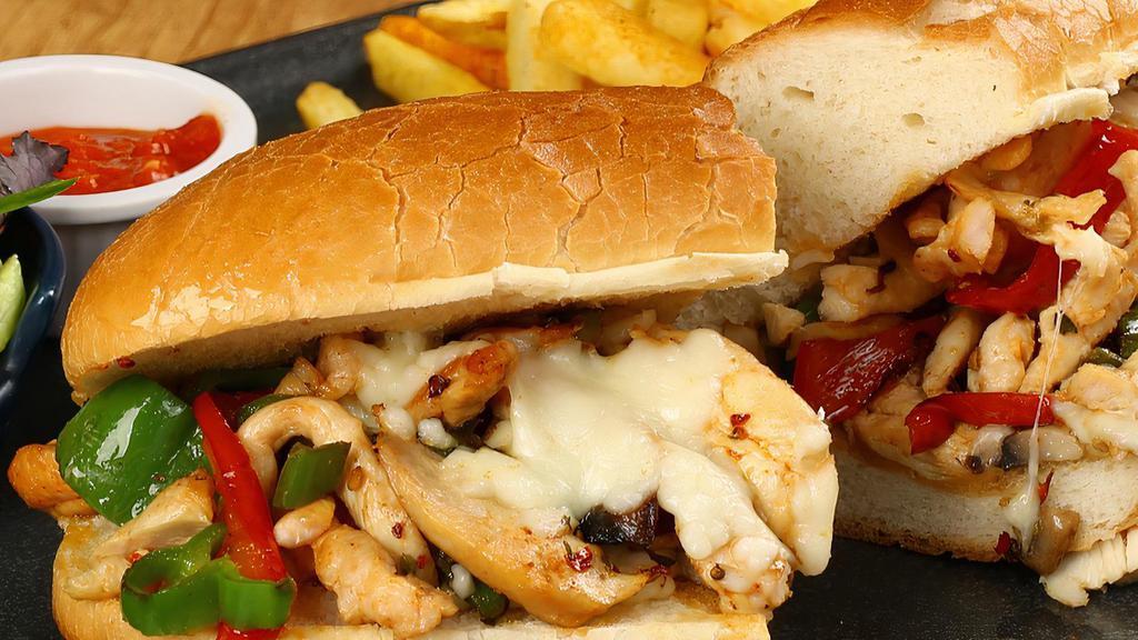Chicken Philly Cheese Steak Sandwich · Delicious sandwich made with shredded Chicken Strips, Swiss cheese, and sautéed vegetables. Topped with mayo.