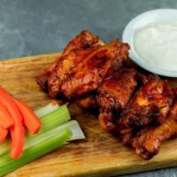 Wings Your Way · Gluten-free. Six or nine wings oven baked, tossed in buffalo, sweet, and spicy or house dry ...
