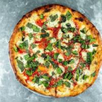 Margherita Thin Crust Pizza · Fresh mozzarella, home-made tomato sauce, fresh basil and parmesan.